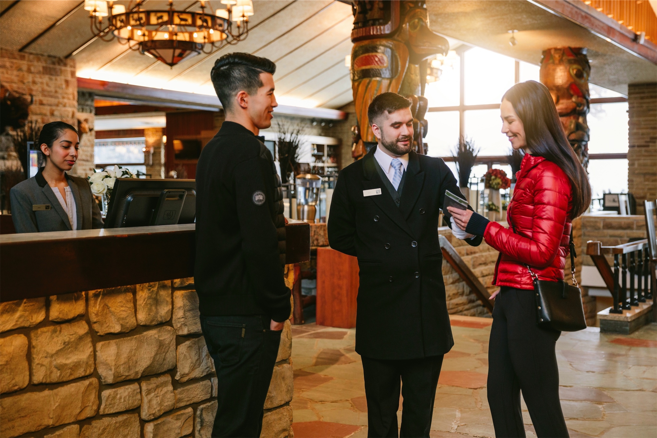 couple talking to guest services in the lobby
